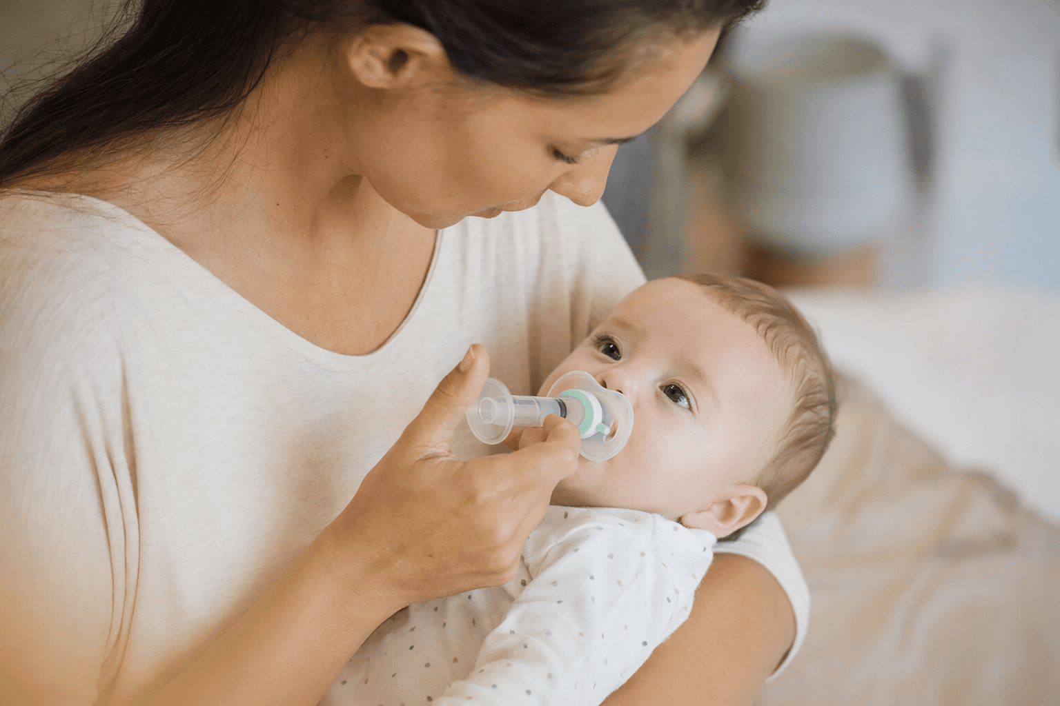 Low-cost pacifier syringe makes giving babies medicine easier