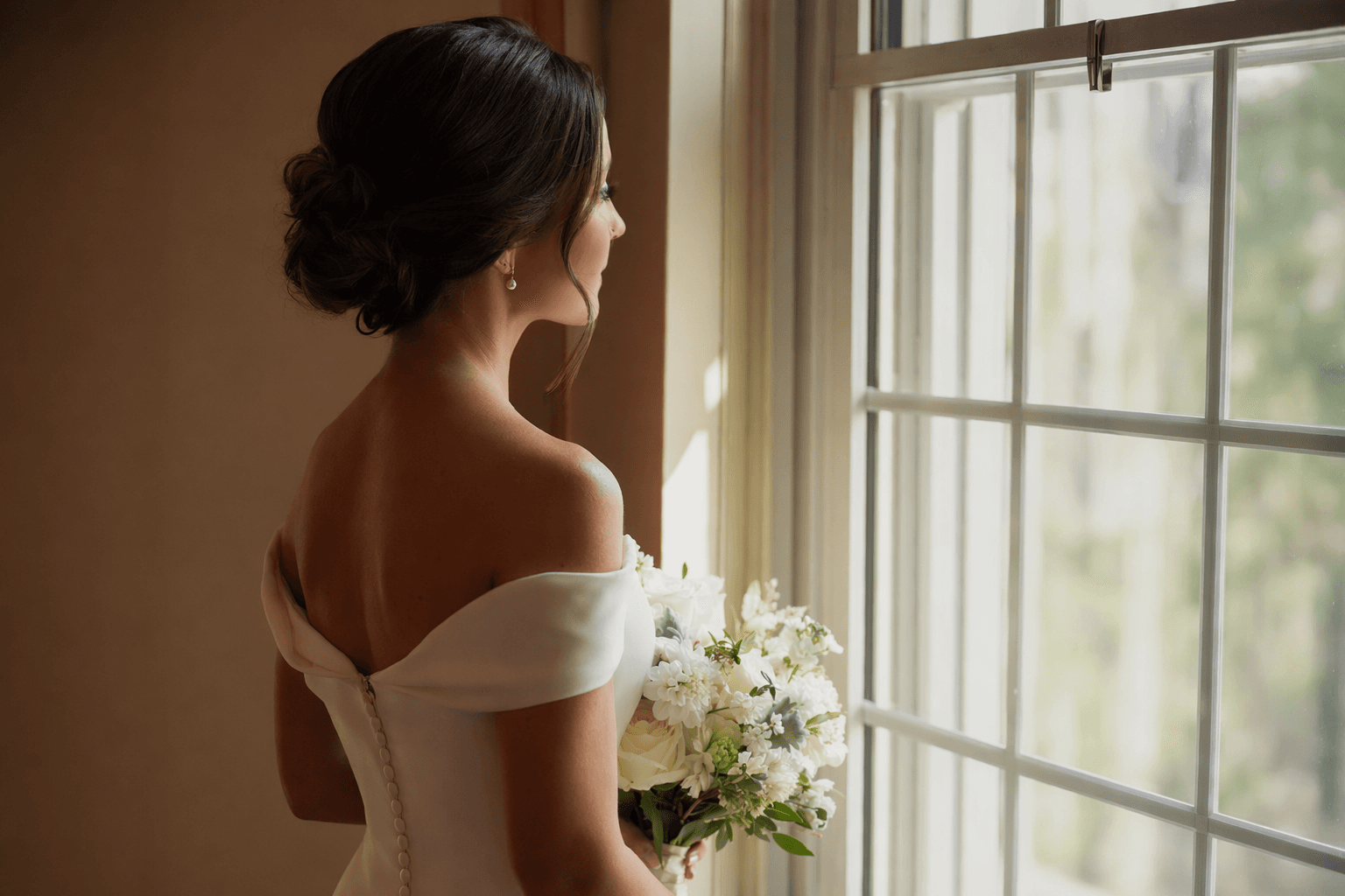 Brides are choosing classic updos and sleek waves for 2026 weddings
