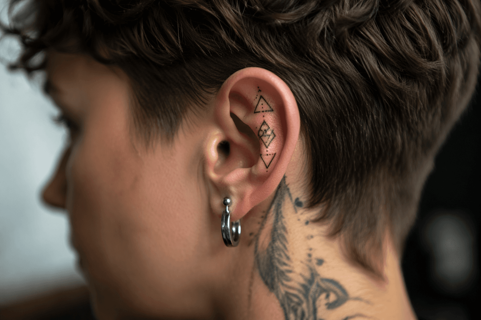Geometric ear tattoos turn tiny skin space into bold style statements
