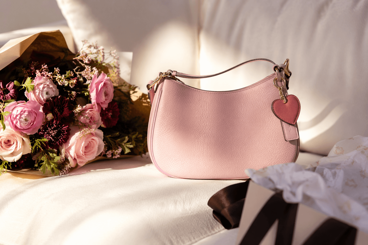 Coach Outlet’s Valentine’s Day shop adds heart-charm bags and pastel gifts