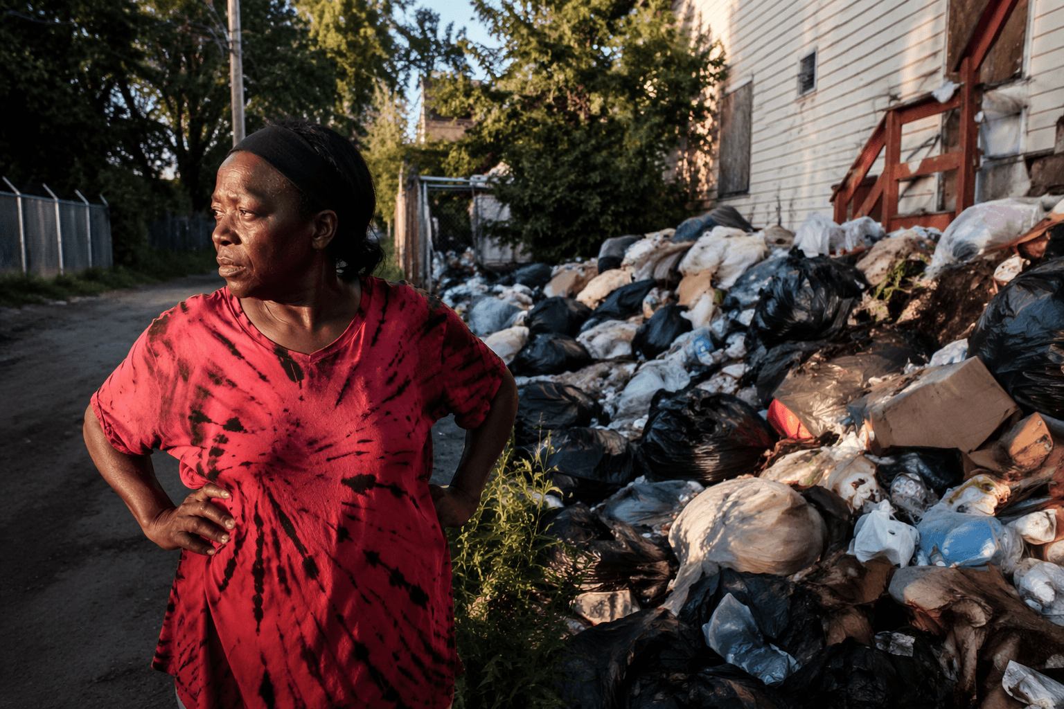 Belair-Edison neighbors say years-long trash pile is fueling rats, stench