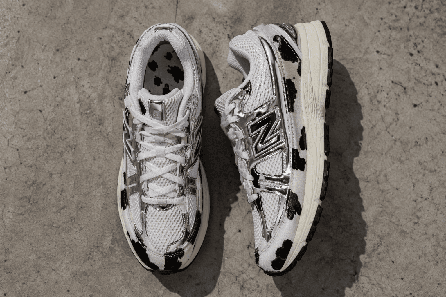 New Balance 204L gets chrome panels and cow-print atmos collab
