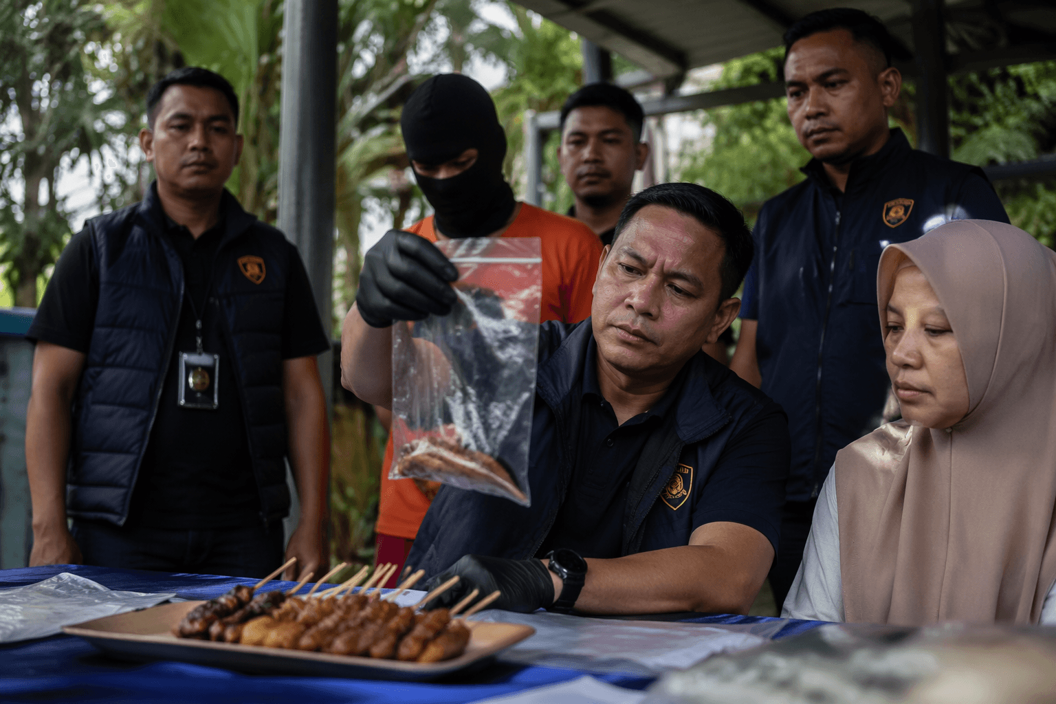 Indonesia police say man poisoned woman with satay over insult