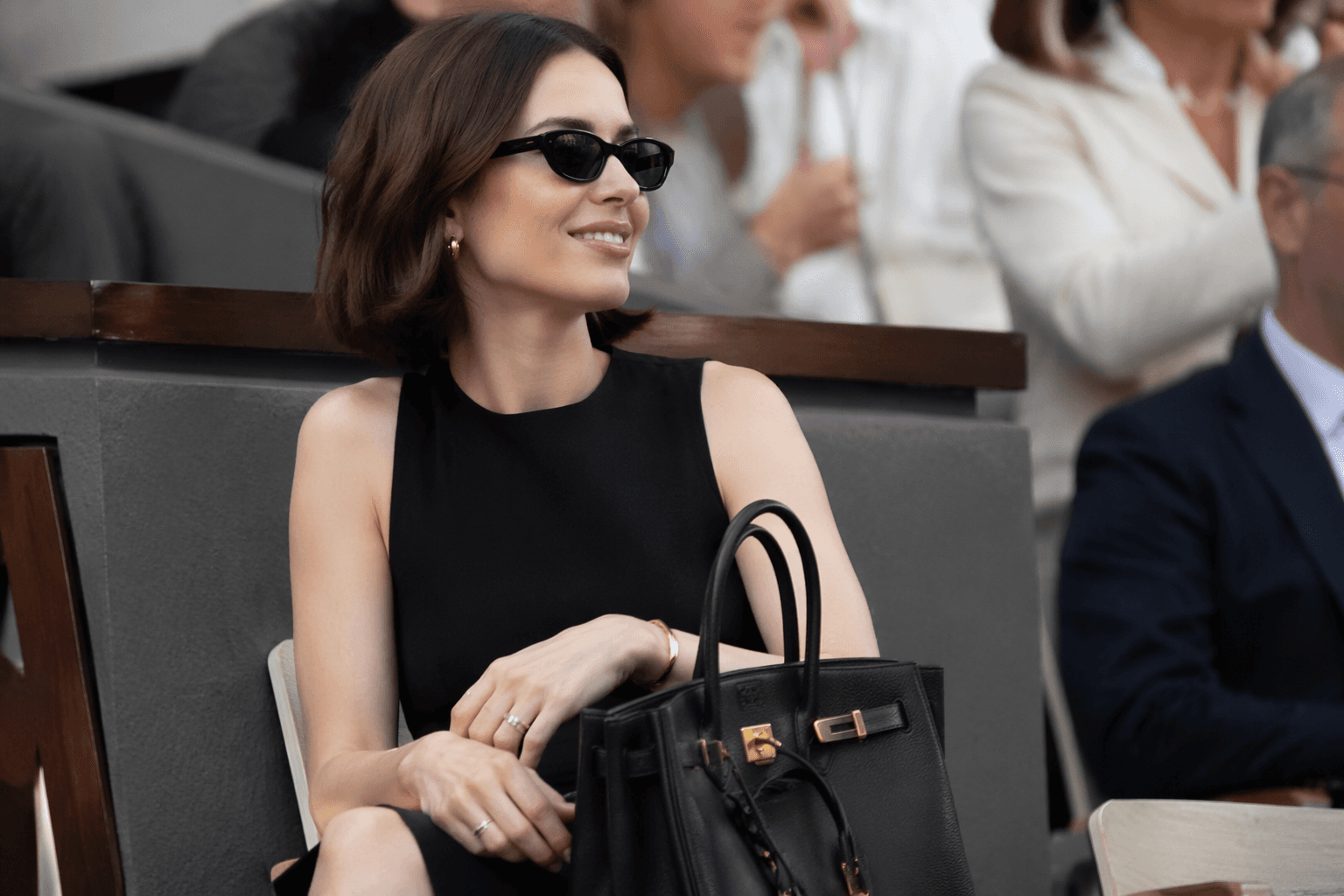 Lily Collins closes Roland-Garros in a black Hermès Birkin, gold accents