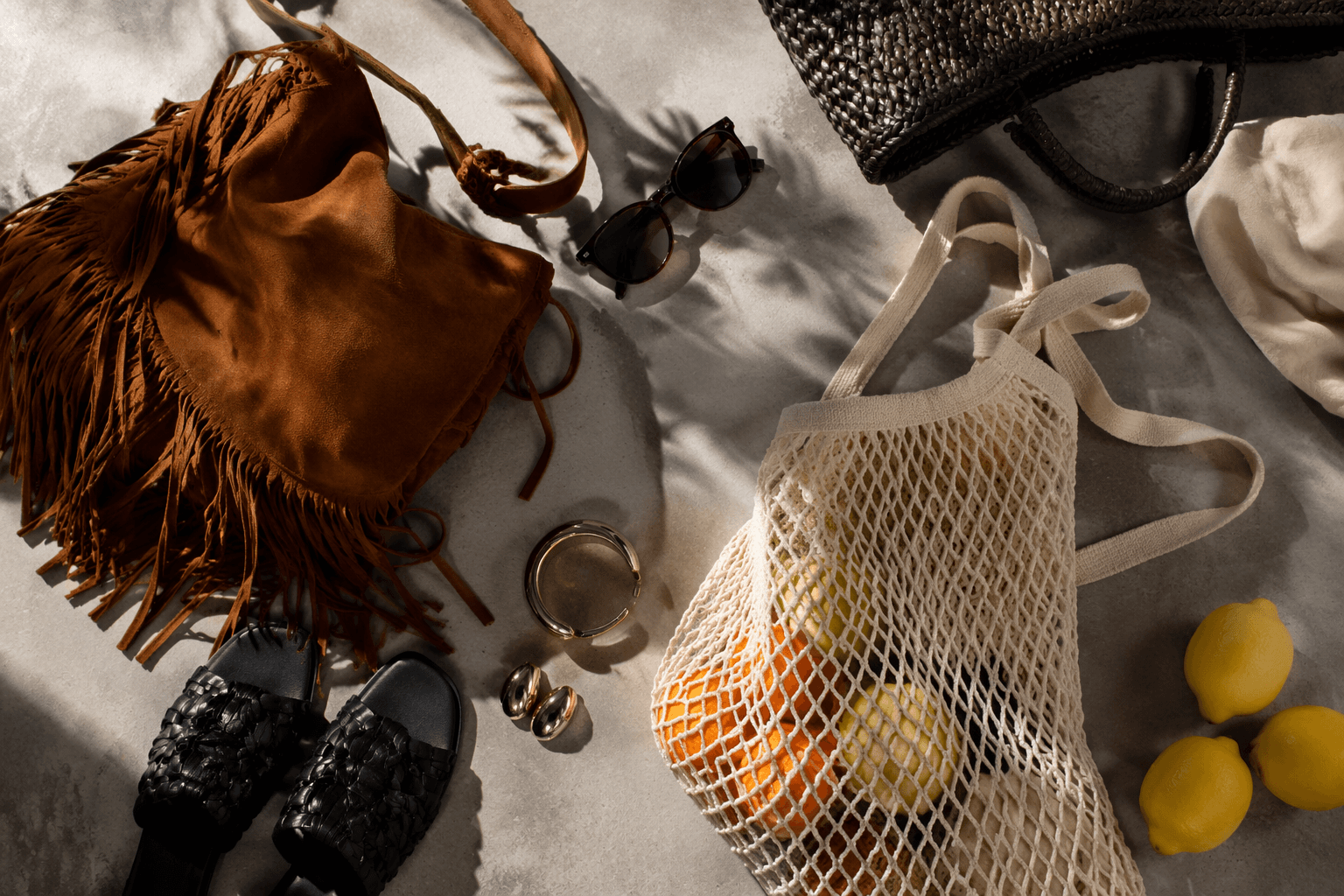 Summer 2026 trends embrace tactile luxury, fringe and supermarket totes