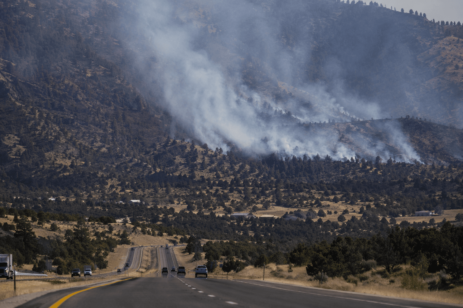 Pelada Fire burns near Canada de Los Alamos, smoke visible from I-25