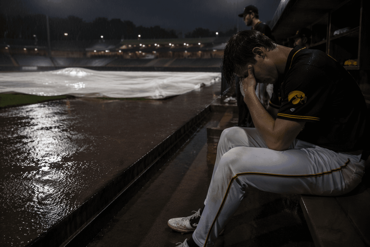 Rain cuts Louisville-Iowa game to 4-4 tie after wild extras rally
