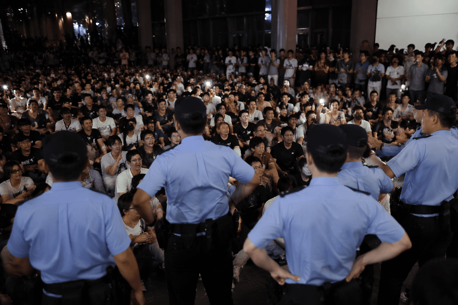 Hundreds protest dog abuse case in rare Chongqing sit-in