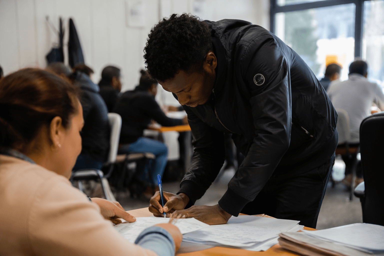 Spain NGOs race to help migrants file regularization papers before deadline