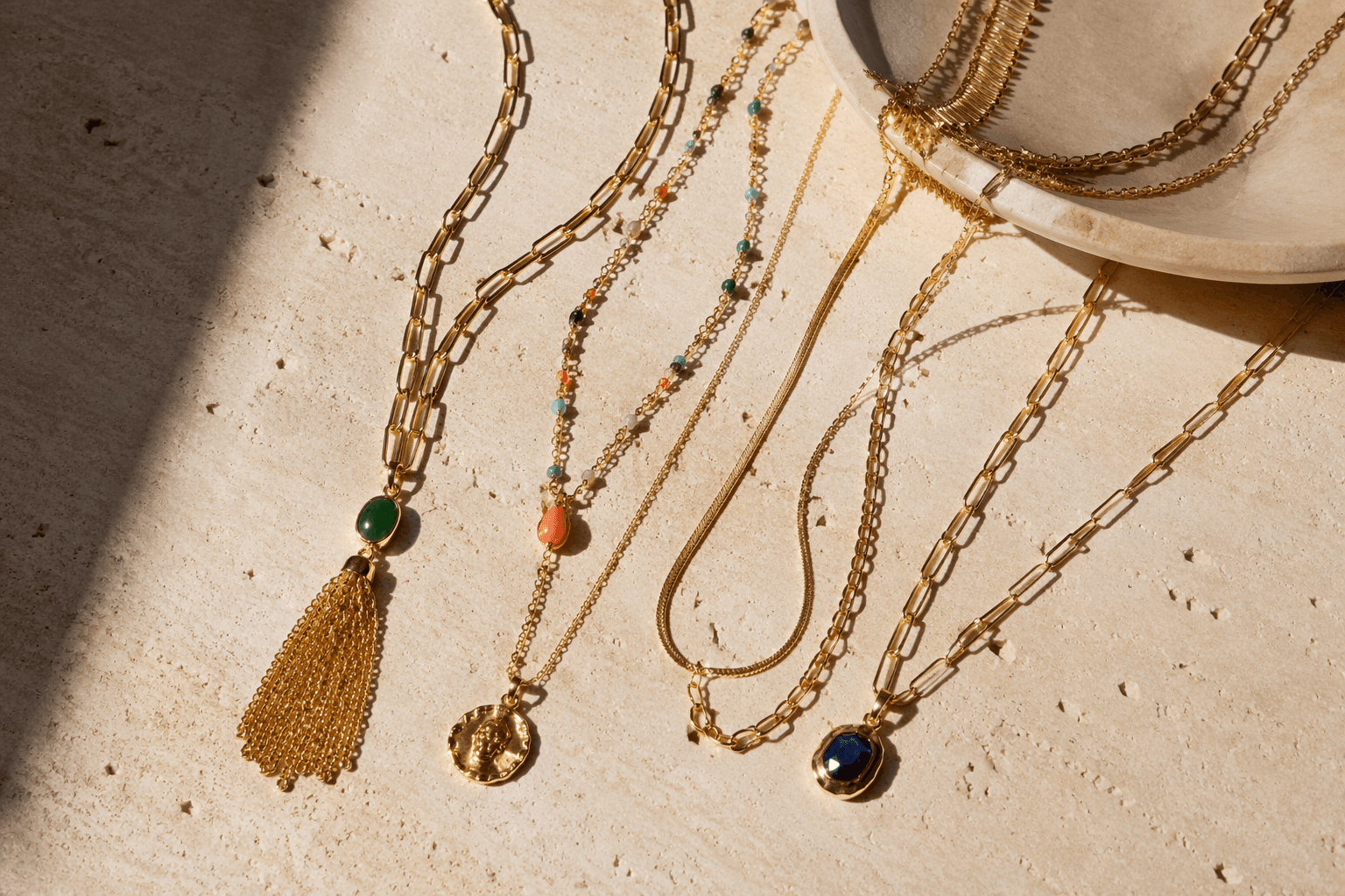 14 new gold necklace styles embrace layers and bold color