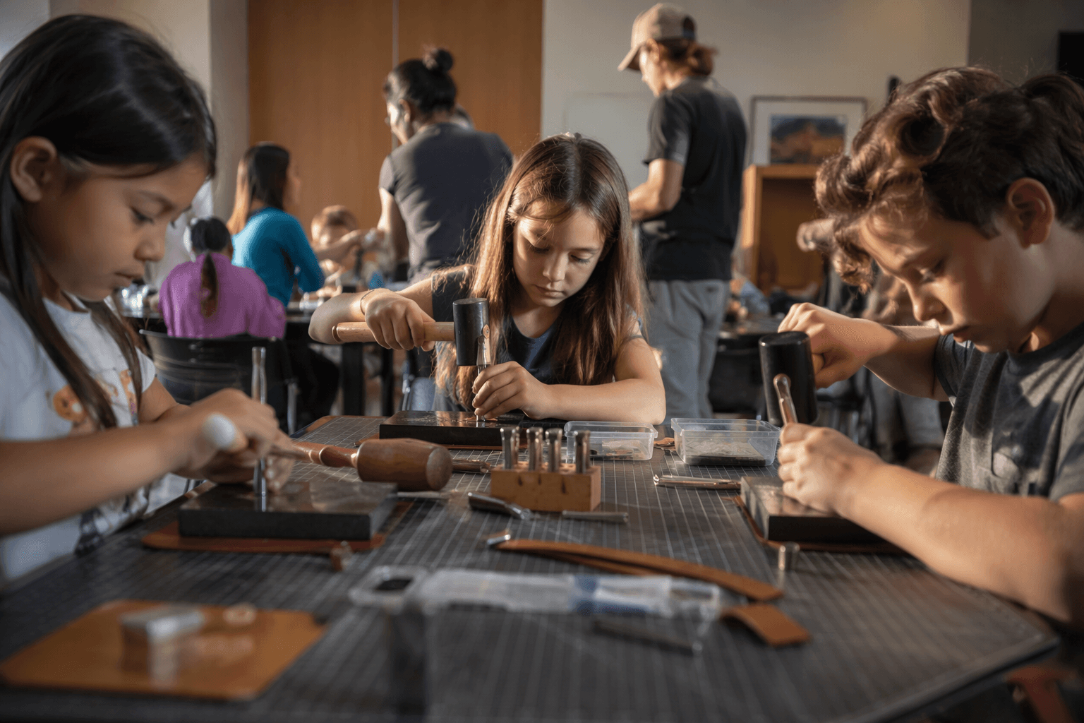 Youth leathercraft workshop brings stamping skills to library kids