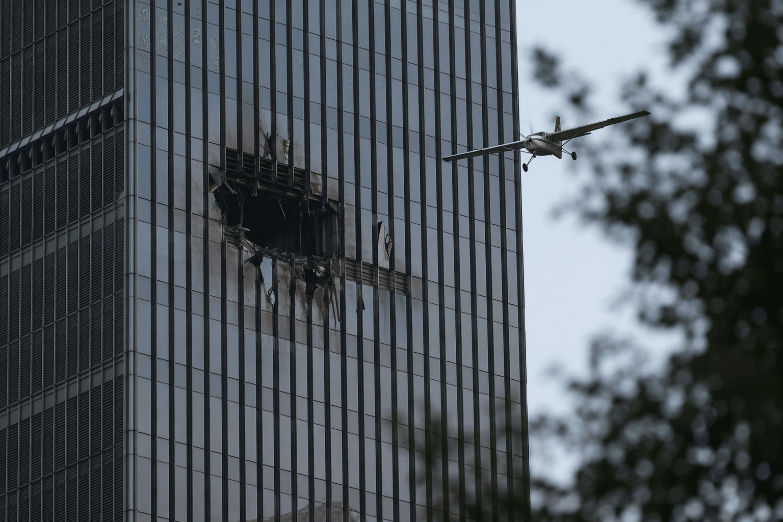 Beijing light plane crash into CITIC Tower injures 13 people