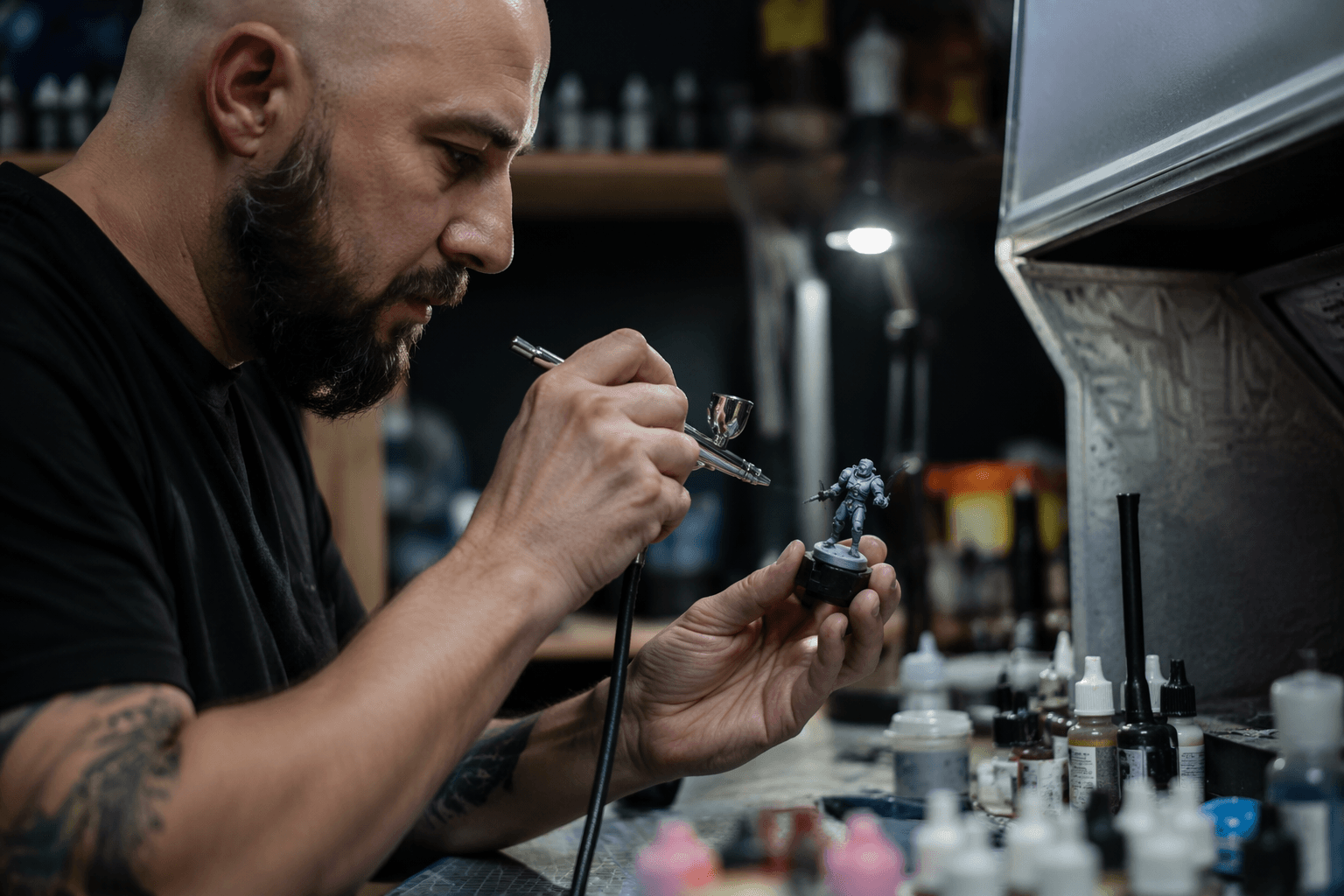 Miniature painters learn airbrush setup for control and smooth basecoats