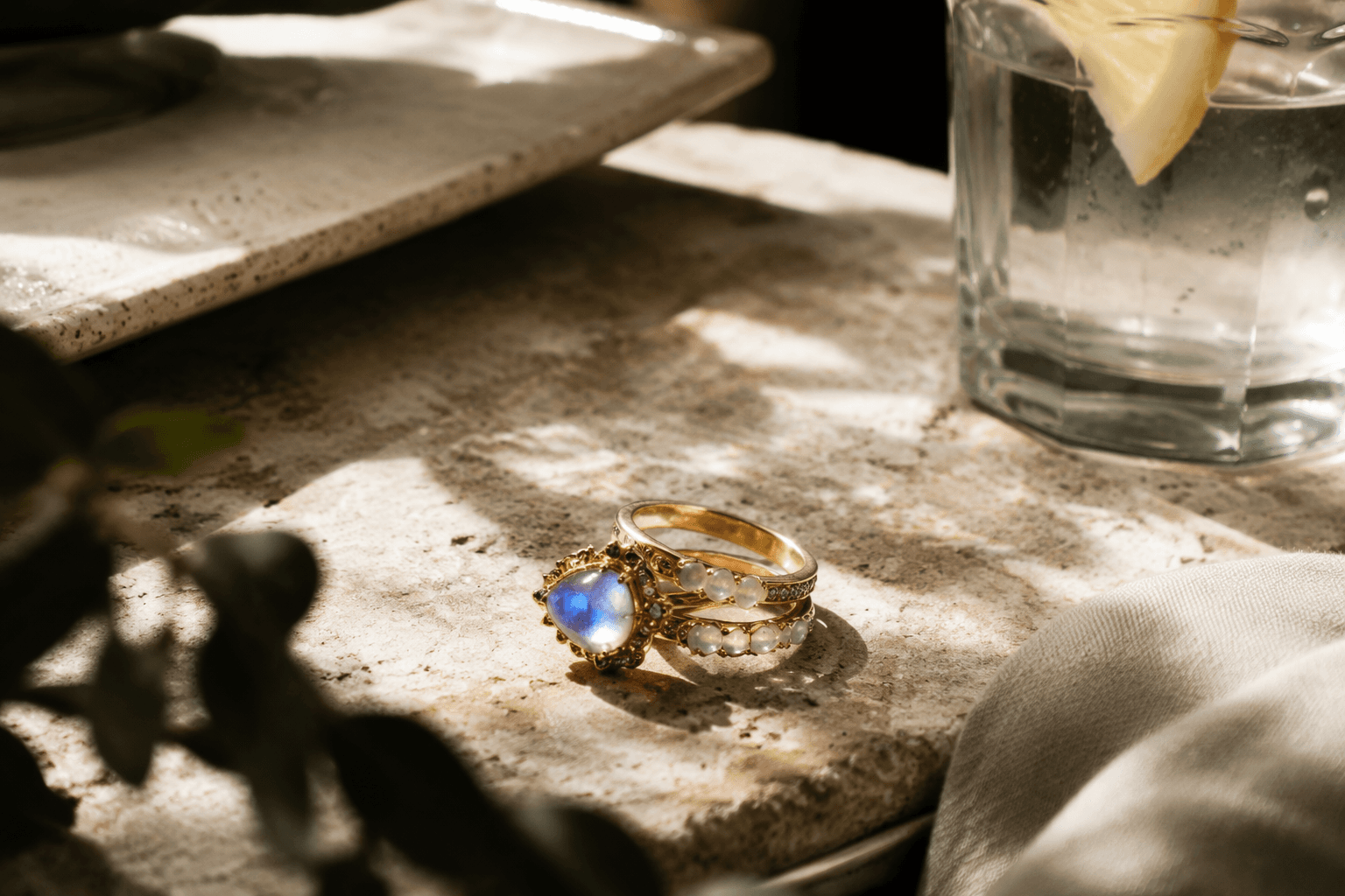 Jessica Alba spotlights blue moonstone rings in layered jewelry look