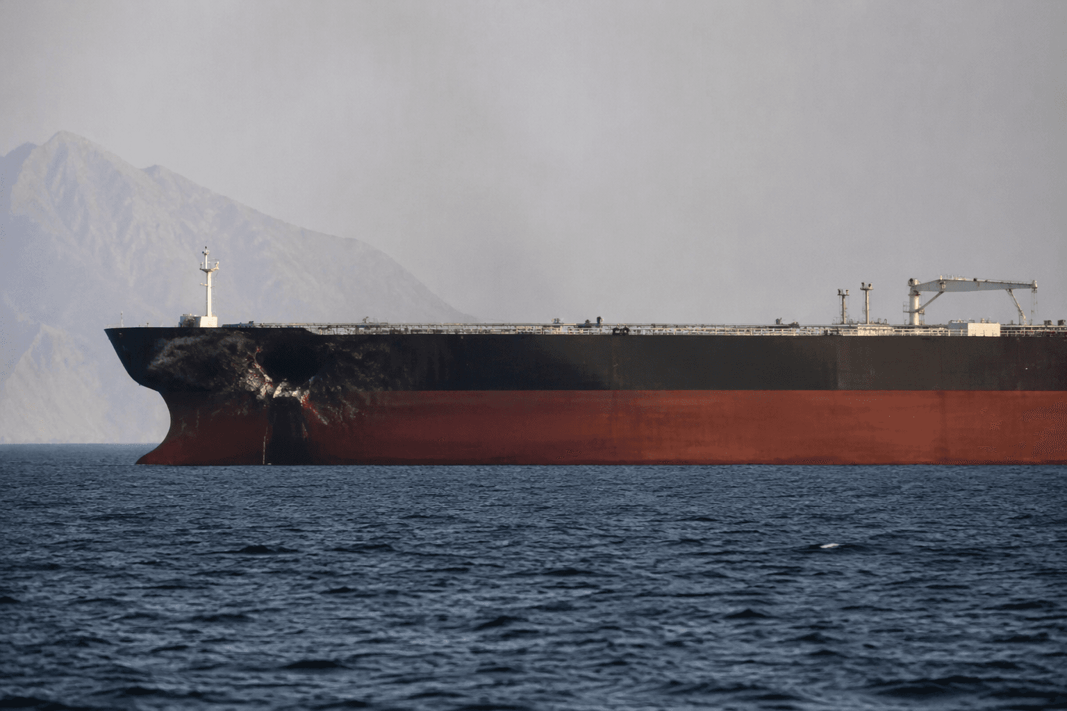 Tanker struck by projectile off Oman near Strait of Hormuz