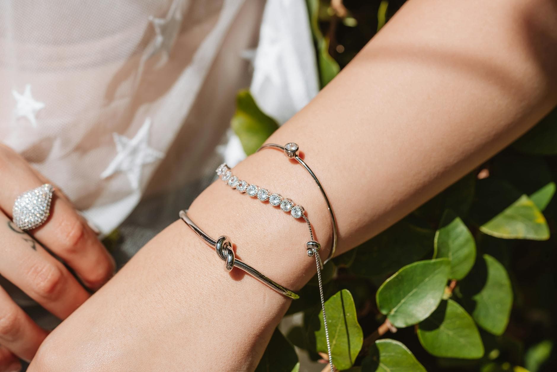 Tactile jewelry adds texture, movement, and grounding to layered stacks