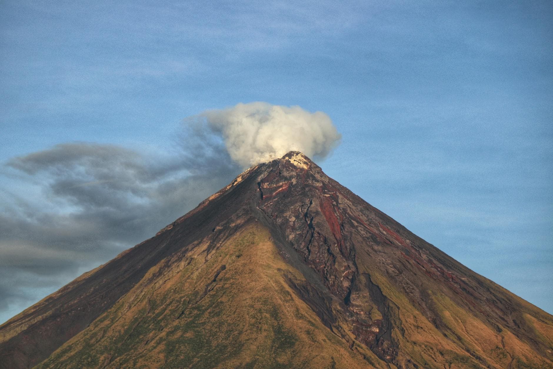 Mayon ashfall forces evacuations, blankets Philippine towns and farms