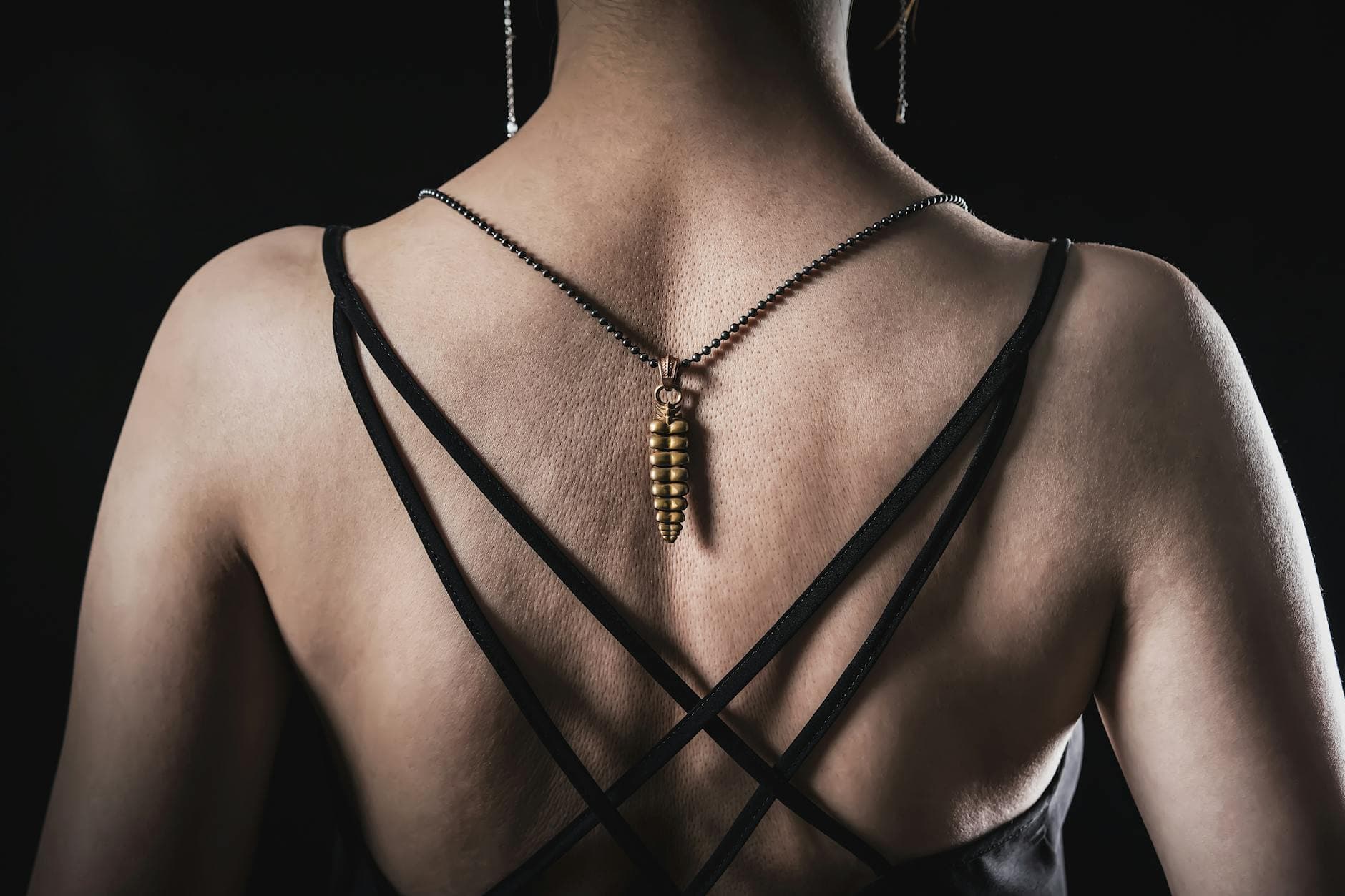 Amulet necklaces lead spring 2026's bold jewelry reset