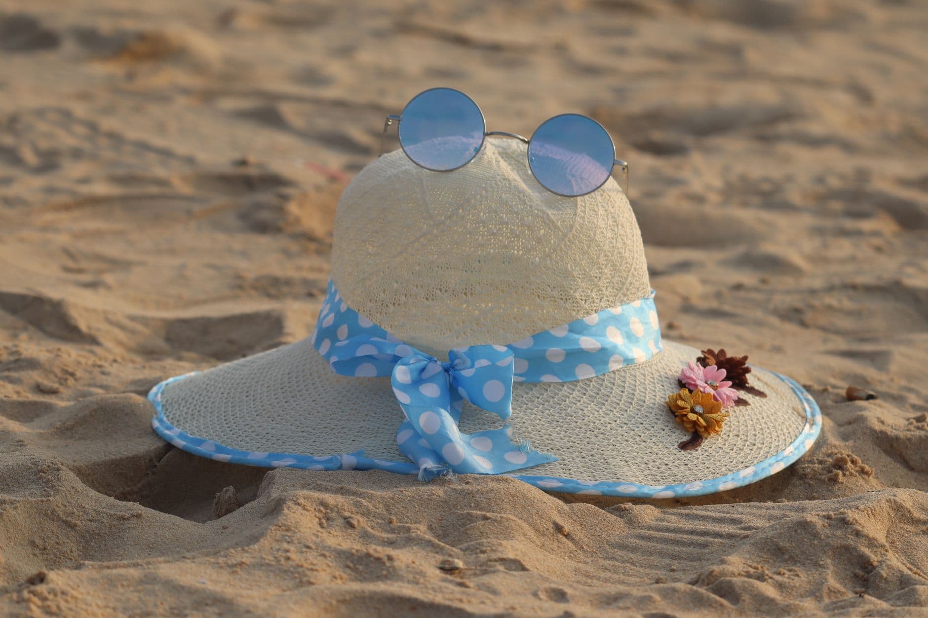Coastal grandmother style gets a summer hat update, from bucket to raffia