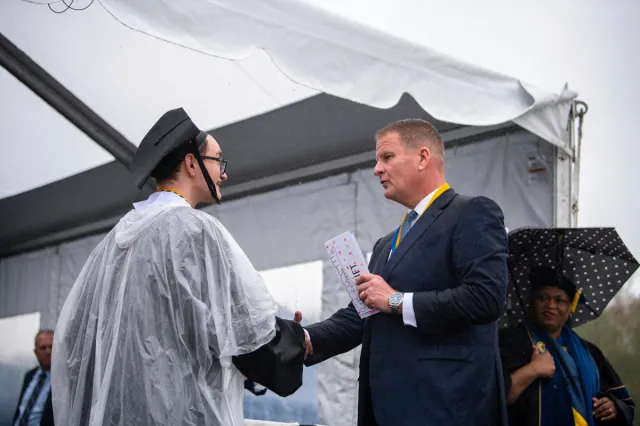 Billionaire gives UMass graduates $1,000 each, asks them to share half