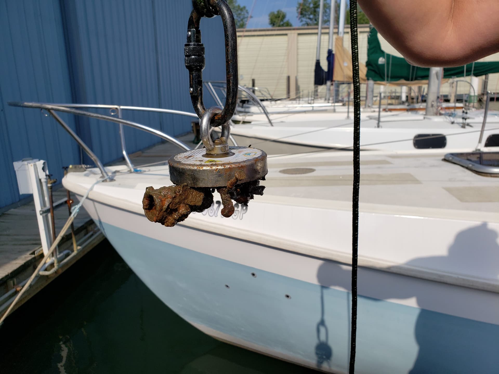 Magnet fishers haul up bikes, knives and rusted junk from waterways