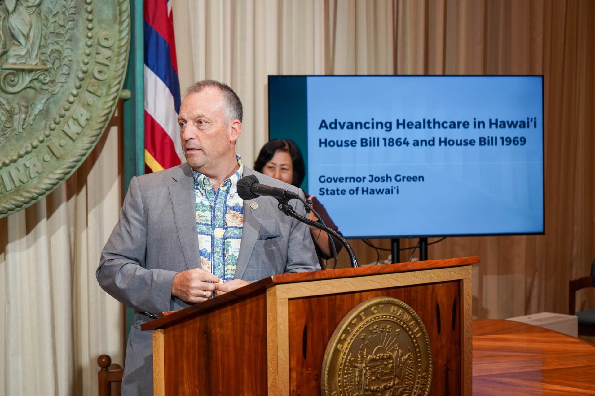Green signs health care access and medical debt relief measures