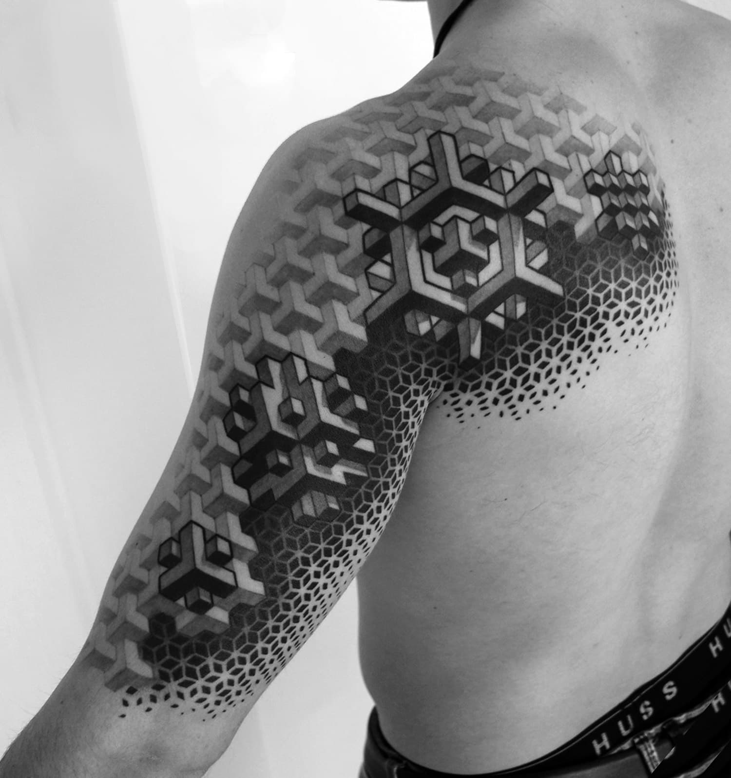 10 artists creating geometric tattoos that span the body