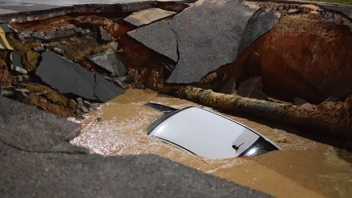 Sinkhole swallows car on East Baltimore street amid storm damage