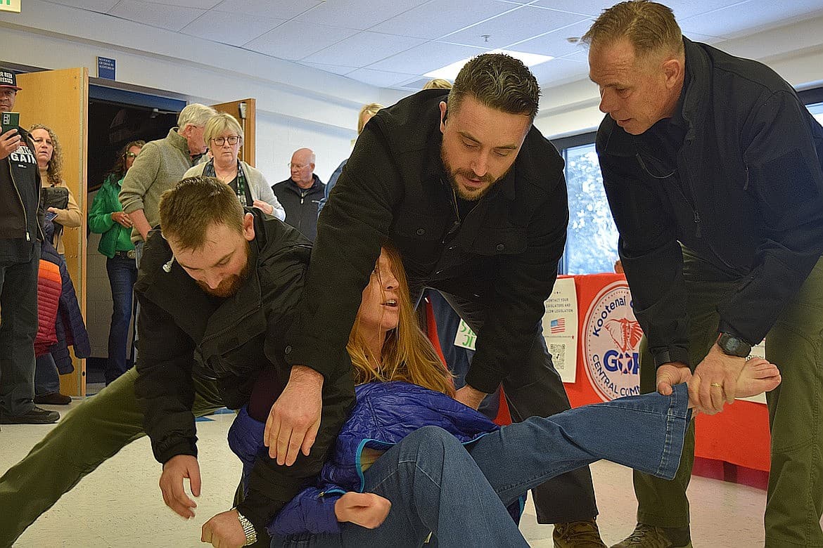 Post Falls woman sues over removal from Coeur d’Alene town hall