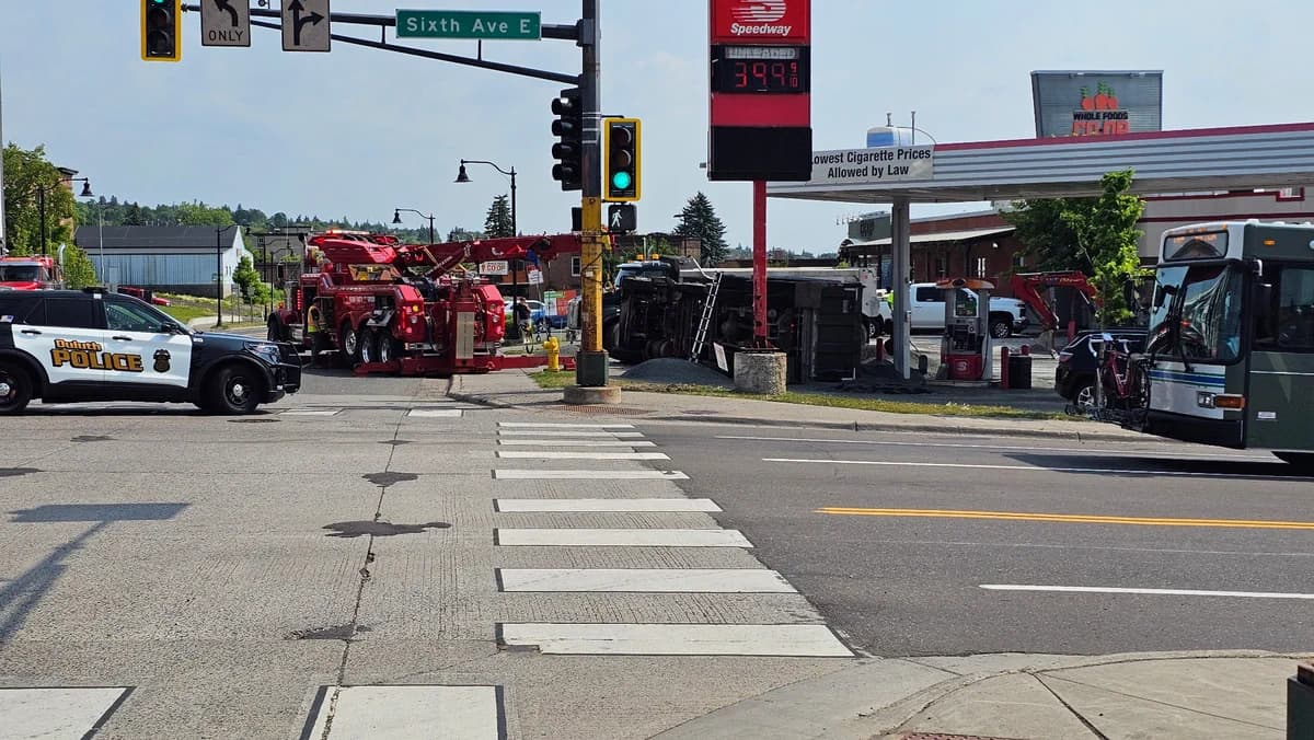 Dump truck overturns in Duluth parking lot, injures multiple people