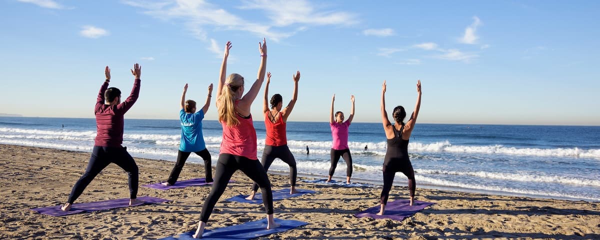 Free beach yoga returns to Hermosa Beach this summer