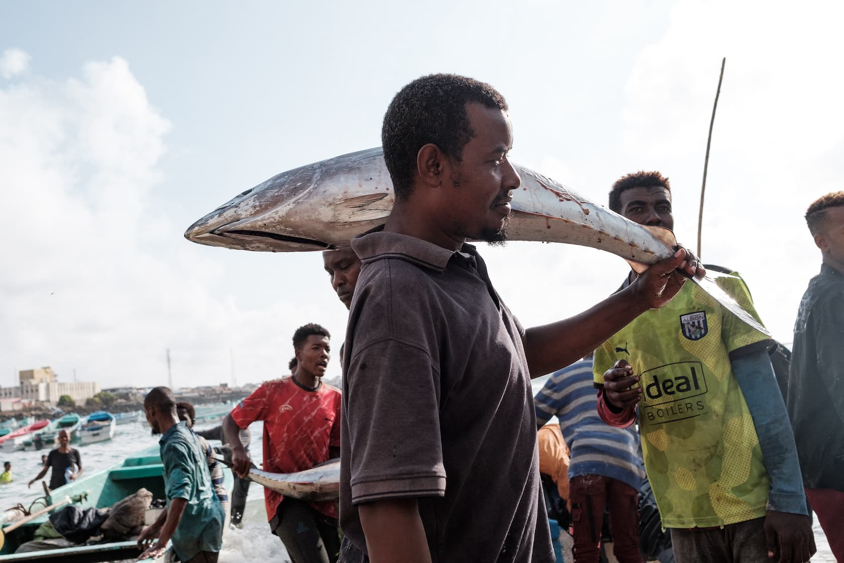 Young Somali fishermen land yellowfin tuna off Mogadishu with handlines