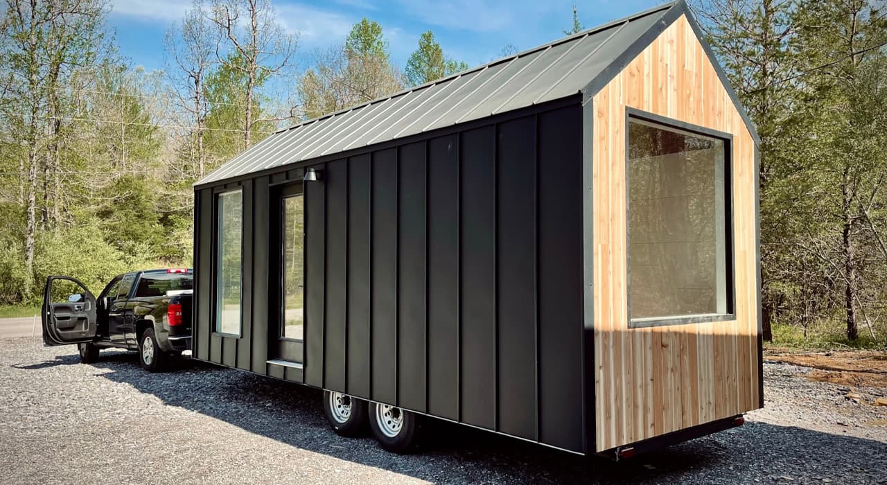 Nordic tiny house lists for $40,500 with warm wood interiors