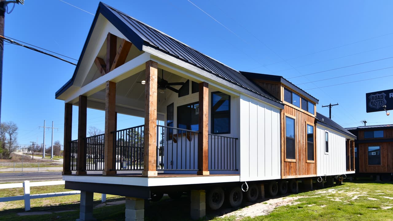 Triple-porch Magnolia tiny house maximizes outdoor living in 399 square feet