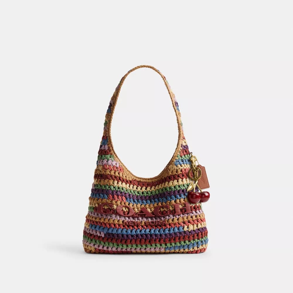 Coach’s straw Brooklyn bag captures the coastal grandmother mood