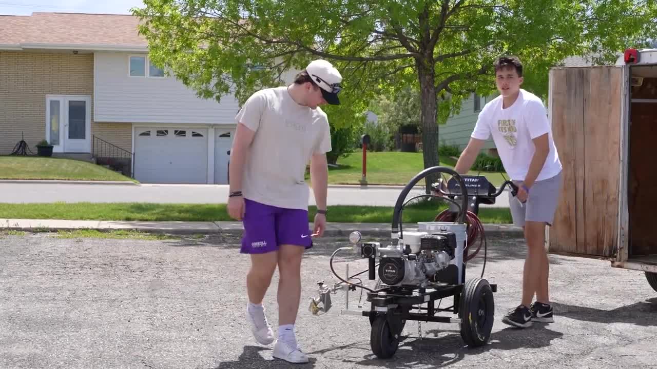 Carroll College players paint Helena lots to fund summer basketball