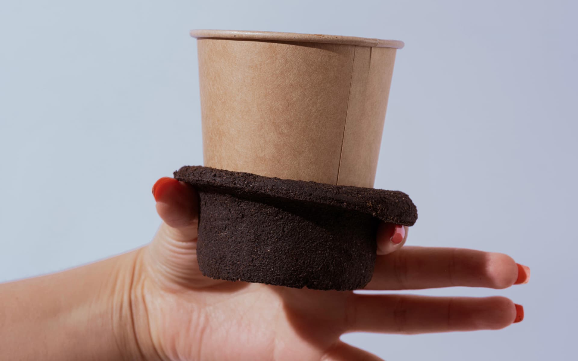 German design students turn coffee waste into compostable cup sleeves