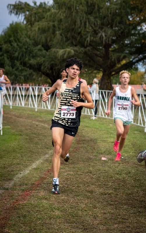 Valerio breaks school 3200m record, Evans wins regional 400m title