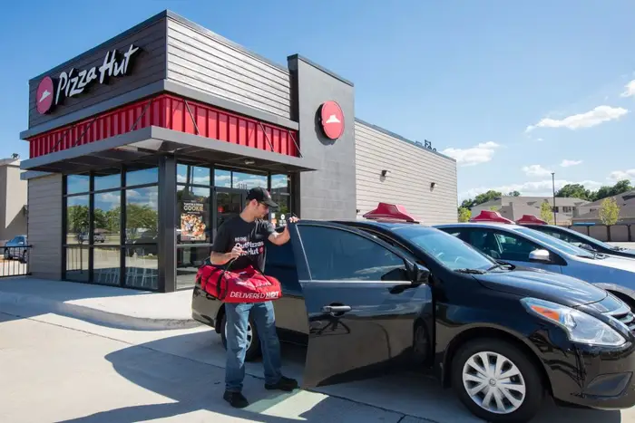 Pizza Hut Delivery Drivers Sue Franchisees Over Vehicle Reimbursement Shortfalls