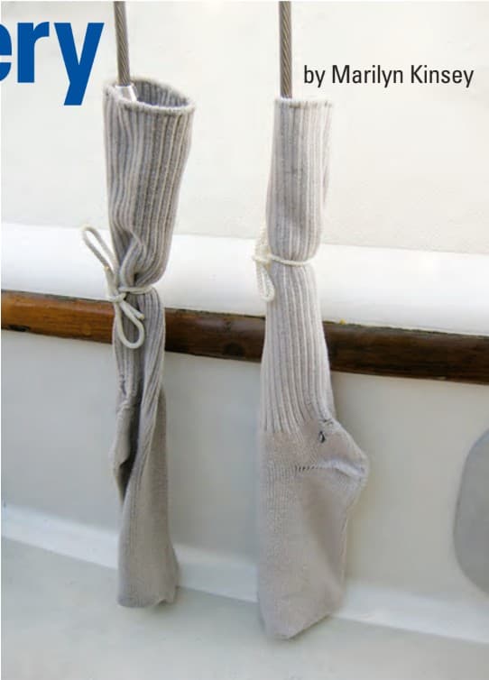 Old socks protect turnbuckles and finish during mast removal