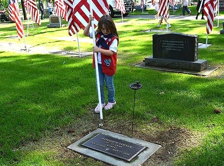 Post Falls volunteers honor veterans with flags at Evergreen Cemetery
