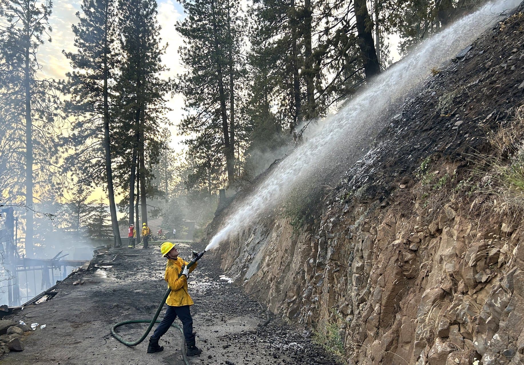 Fire destroys Hayden Lake home, crews contain hillside spread