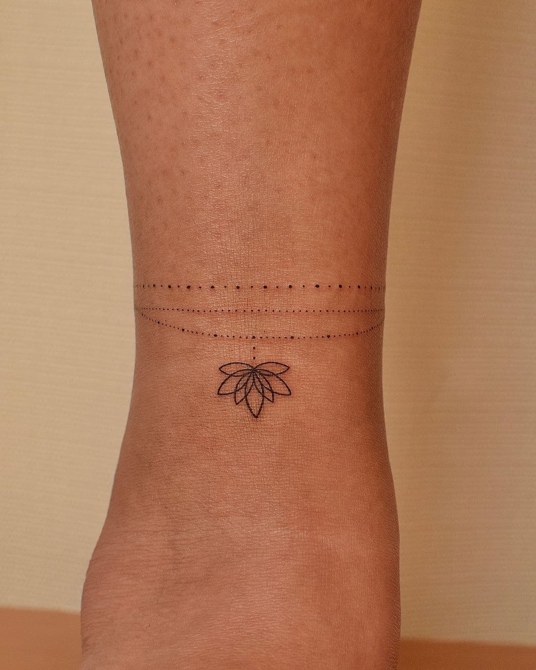 Geometric ankle tattoos balance clean linework with delicate flow