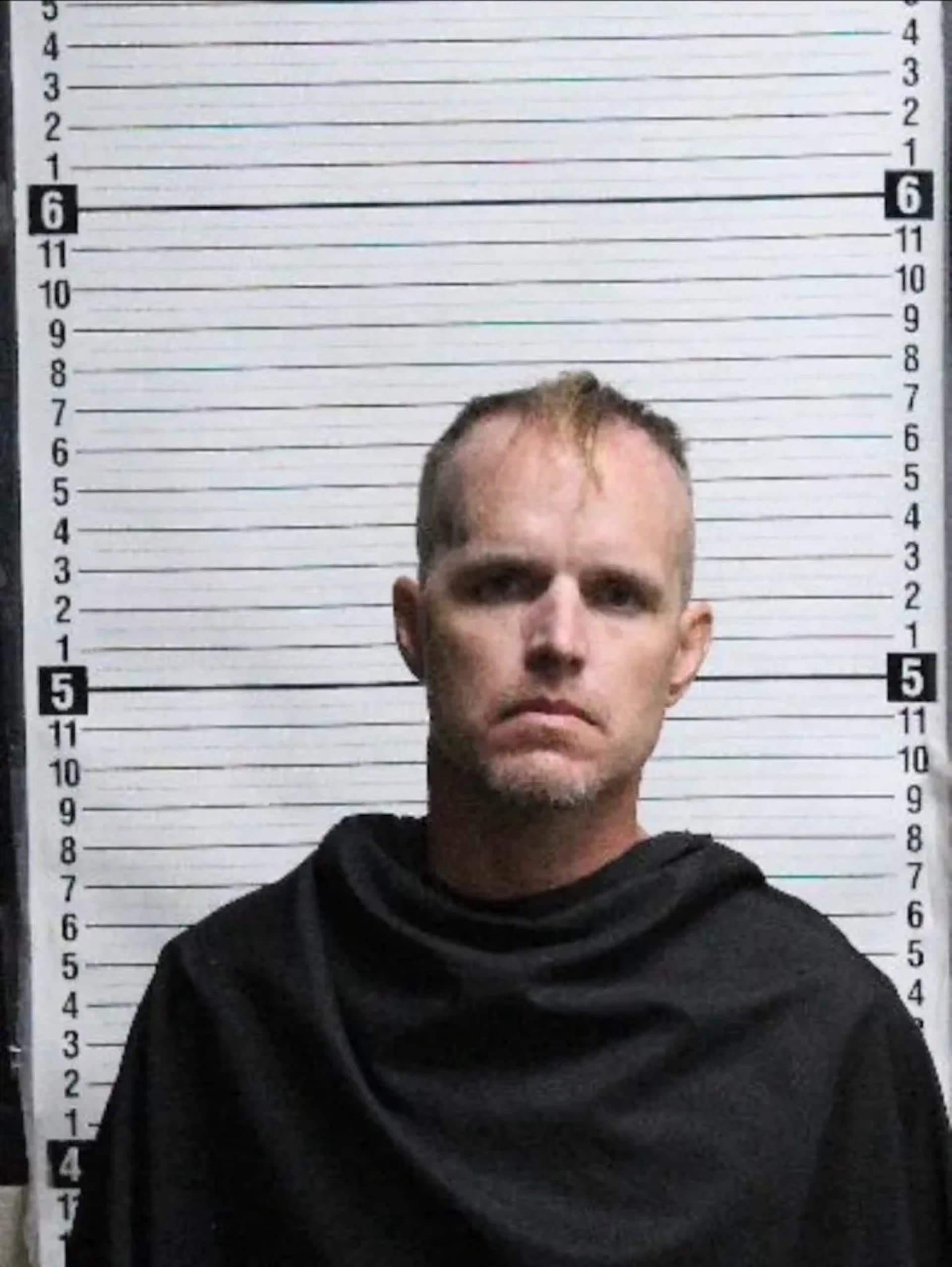 Suspect arrested after overnight fire destroys Woodfin coffee shop