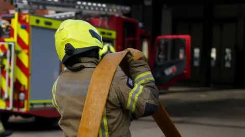 Three men die after fire at White City pavilion in west London