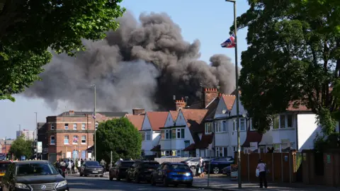 Fire at Golders Green supermarket sends smoke over north-west London