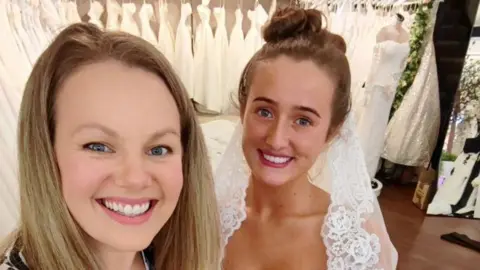 Lancashire seamstress hand-sews 40ft train for Venezuela Fury wedding dress