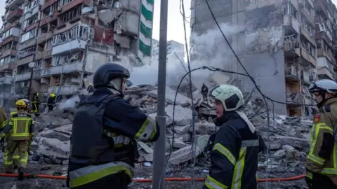 Russia's overnight barrage hits Kyiv apartment block, kills two
