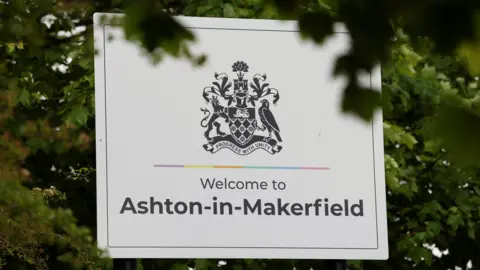 Andy Burnham leads 14-candidate contest in Greater Manchester by-election