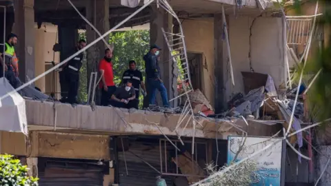 Israel strikes Hezbollah in Beirut, Iran warns deal could unravel